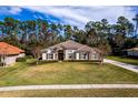 Single story home with tile roof and manicured lawn at 1458 Foxtail Ct, Lake Mary, FL 32746