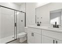 Modern bathroom with double sink vanity, frameless glass shower door and sleek black fixtures at 1719 Sw 166Th St, Ocala, FL 34473