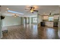 Spacious living area with wood floors and high ceilings at 2405 Se 157Th Lane Rd, Summerfield, FL 34491