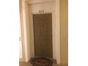 Apartment front door with welcome mat at 3344 Robert Trent Jones Dr # 30505, Orlando, FL 32835