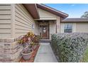 Inviting front entry with brick walkway and lush landscaping at 4960 Se 37Th Ct, Ocala, FL 34480