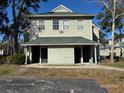 Front view of a two-story condo building at 6034 Westgate Dr # 202, Orlando, FL 32835