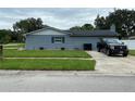 Gray house with a side yard and plenty of space at 6642 Matchett Rd, Orlando, FL 32809