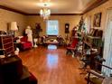 Spacious living room with hardwood floors and antique furniture at 824 Lake Elbert Ct, Winter Haven, FL 33881