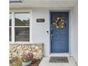 Welcoming front door entrance with a floral wreath at 1062 Blue Horizon Dr, Deltona, FL 32725