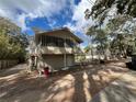 Angled view of home with screened porch and fenced in yard at 113 W 19Th St, Sanford, FL 32771