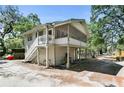 Charming raised cottage with a wrap-around porch and spacious backyard at 113 W 19Th St, Sanford, FL 32771