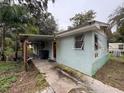 Charming one-story home with a mural and a carport at 1504 Laun Pl, Lakeland, FL 33803