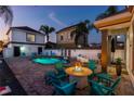 Relaxing pool with patio furniture and fire pit at 1549 Corolla Ct, Reunion, FL 34747