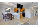 Open concept dining area with kitchen views and a wooden table at 16583 Cedar Crest Dr, Orlando, FL 32828