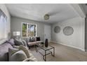 Living room featuring neutral decor, stylish wall art, and ample natural light at 2471 E 20Th St, Sanford, FL 32771