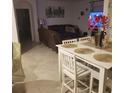 Bright dining area with a white table and six chairs at 2950 Omaha Dr, Deltona, FL 32738