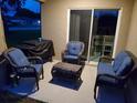 Relaxing patio with wicker furniture and a grill at 2950 Omaha Dr, Deltona, FL 32738