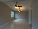 Bright dining area with tile flooring, chandelier, and ceiling fan at 359 Prevo Dr, Apopka, FL 32712