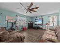 Spacious living room with hardwood floors and comfy sofas at 3666 Maidencain St, Clermont, FL 34714