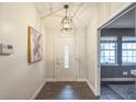 Bright entryway with tiled floor, a white door, and artwork at 4491 Yachtmans Ct, Orlando, FL 32812