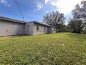 Side view of the house showing a large backyard at 4706 Kanoy Dr, Lakeland, FL 33805