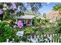 Charming house exterior with white picket fence and lush landscaping at 506 N Dillard St, Winter Garden, FL 34787