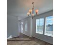 Bright dining room with hardwood floors and chandelier at 6581 Quest St, St Cloud, FL 34771