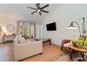 Spacious living room with light flooring and neutral decor at 701 Grant Ave, Mount Dora, FL 32757