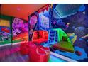 ' bedroom with bunk beds, superhero murals, and beanbag chairs at 801 Golden Bear Dr, Kissimmee, FL 34747