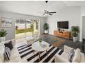 Bright living room featuring a stylish mid-century modern decor at 8813 Parliament Ct, Kissimmee, FL 34747