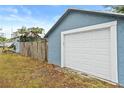 White garage door attached to the side of the house at 922 Wyoming Ave, St Cloud, FL 34769