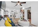 Cozy living room with a blue sofa and a view into the kitchen at 922 Wyoming Ave, St Cloud, FL 34769