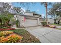 Charming home with a well-manicured lawn and a two-car garage at 1106 Woodbine St, Fern Park, FL 32730