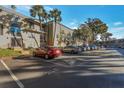 Parking lot with cars parked in front of building at 4017 Versailles Dr # 4017F, Orlando, FL 32808