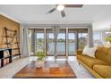 Living room with lake view from sliding glass doors at 670 Lake Villas Dr # D, Altamonte Springs, FL 32701