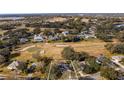 House nestled in a golf course community with scenic surroundings at 8835 Spyglass Loop, Clermont, FL 34711