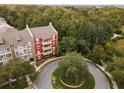 Aerial view of apartment building near a roundabout and trees at 1410 Celebration Ave # 101, Celebration, FL 34747