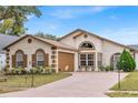 One story home with attached garage and landscaped front yard at 2041 Black Hawk St, Clermont, FL 34714