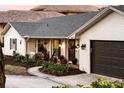 White brick home with dark brown garage door at 2501 Jennifer Hope Blvd, Longwood, FL 32779