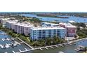 Aerial view of waterfront community with condos and boat docks at 3 Riverwalk Dr # 405, New Smyrna Beach, FL 32169