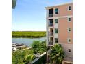 Condo building exterior showcasing water views and lush landscaping at 3 Riverwalk Dr # 405, New Smyrna Beach, FL 32169