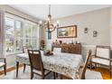 Elegant dining room with a chandelier and wood table at 3566 Tropical Seas Loop, Tavares, FL 32778