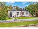 Updated home with modern exterior and beautiful landscaping at 631 Callahan St, Winter Park, FL 32789