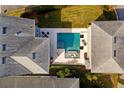 Aerial view of a backyard pool and patio at 9203 Neher St, Orlando, FL 32827