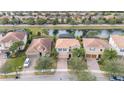 Community view showcasing lake, homes, and landscaping at 12088 Uleta Ln, Orlando, FL 32827