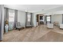 Spacious living room with fireplace, built-in shelving, and neutral decor at 131 Cambria Grove Cir, Davenport, FL 33837