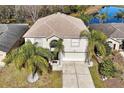Two-story house with a view of the backyard and a pond at 1633 Corner Meadow Cir, Orlando, FL 32820