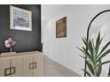 Bright entryway with contemporary decor, mirror, and console table at 2058 Crape Jasmine Ln, Orlando, FL 32824