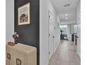 Modern entryway, view toward living room and kitchen at 2058 Crape Jasmine Ln, Orlando, FL 32824