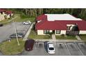 Aerial view of condo showing building and parking lot at 532 Hunter Cir, Kissimmee, FL 34758