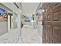 Bright entryway with marble floor and access to living room at 532 Hunter Cir, Kissimmee, FL 34758