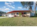 Charming ranch home with mature trees and a spacious yard at 716 Katherine St, South Daytona, FL 32119