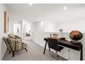 Loft area with desk and two chairs, overlooking lower level at 7260 Oakmoss Loop, Davenport, FL 33837