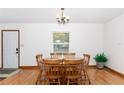 Dining room with wood table and chairs at 9877 7Th Ave, Orlando, FL 32824
